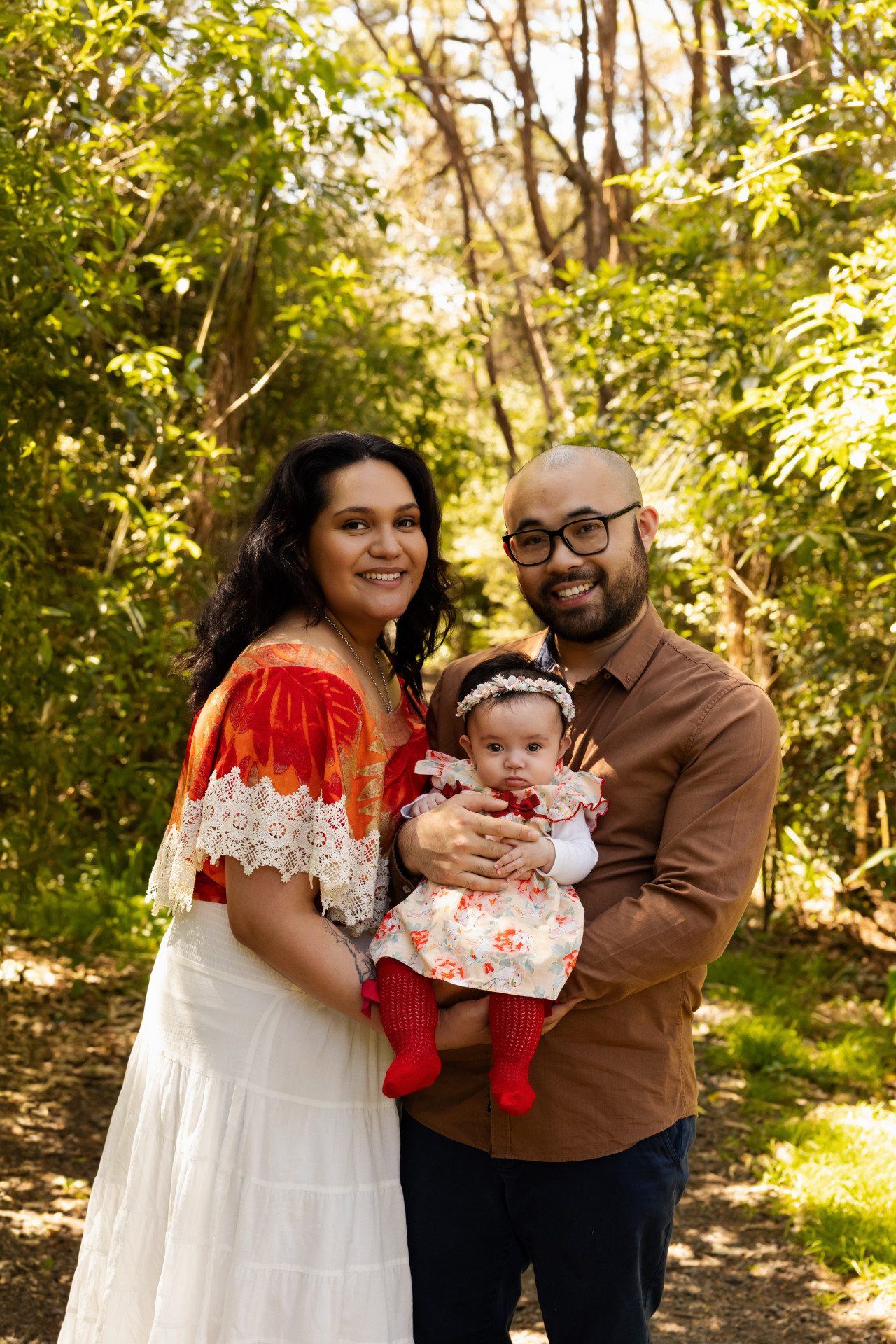 family in the park looking at camera