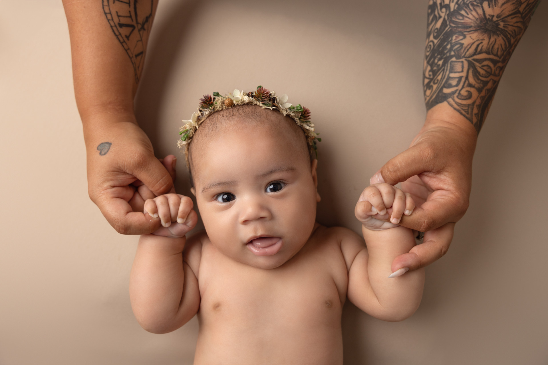 mama holding babys hands