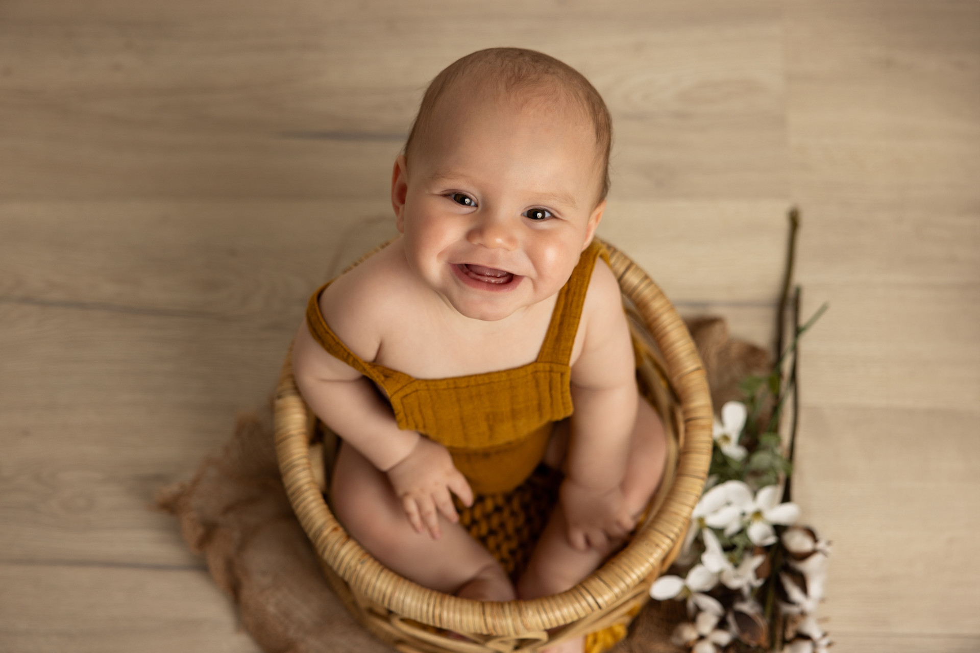 baby in round basket