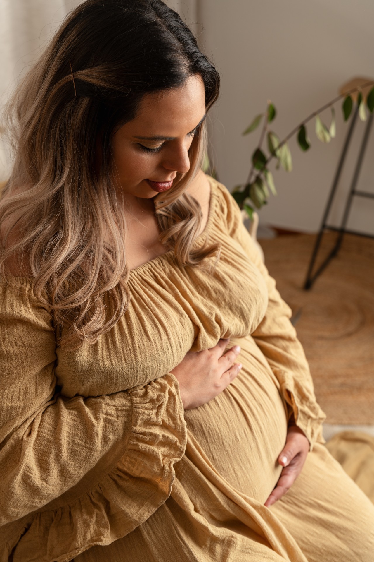 woman touching pregnant belly
