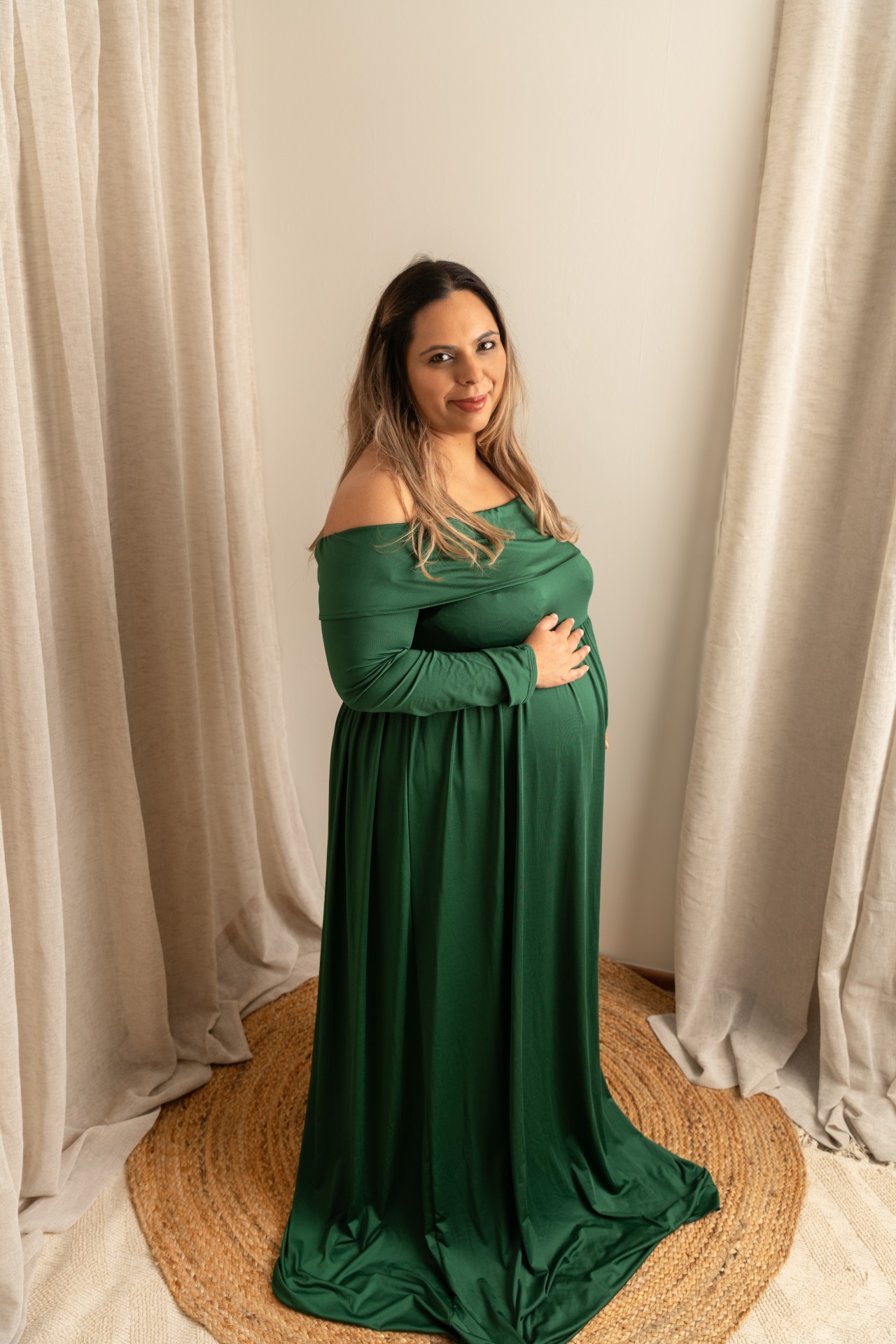maternity portrait in the studio with green dress