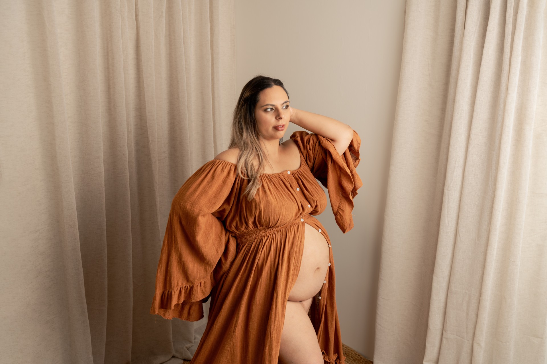 pregnant woman in orange maternity gown