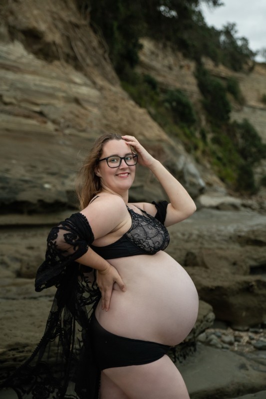 pregnant lady in black underwear posing