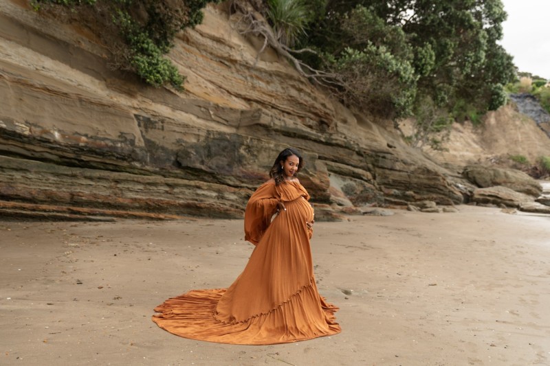 pregnant mum in luxury maternity gown during her maternity session