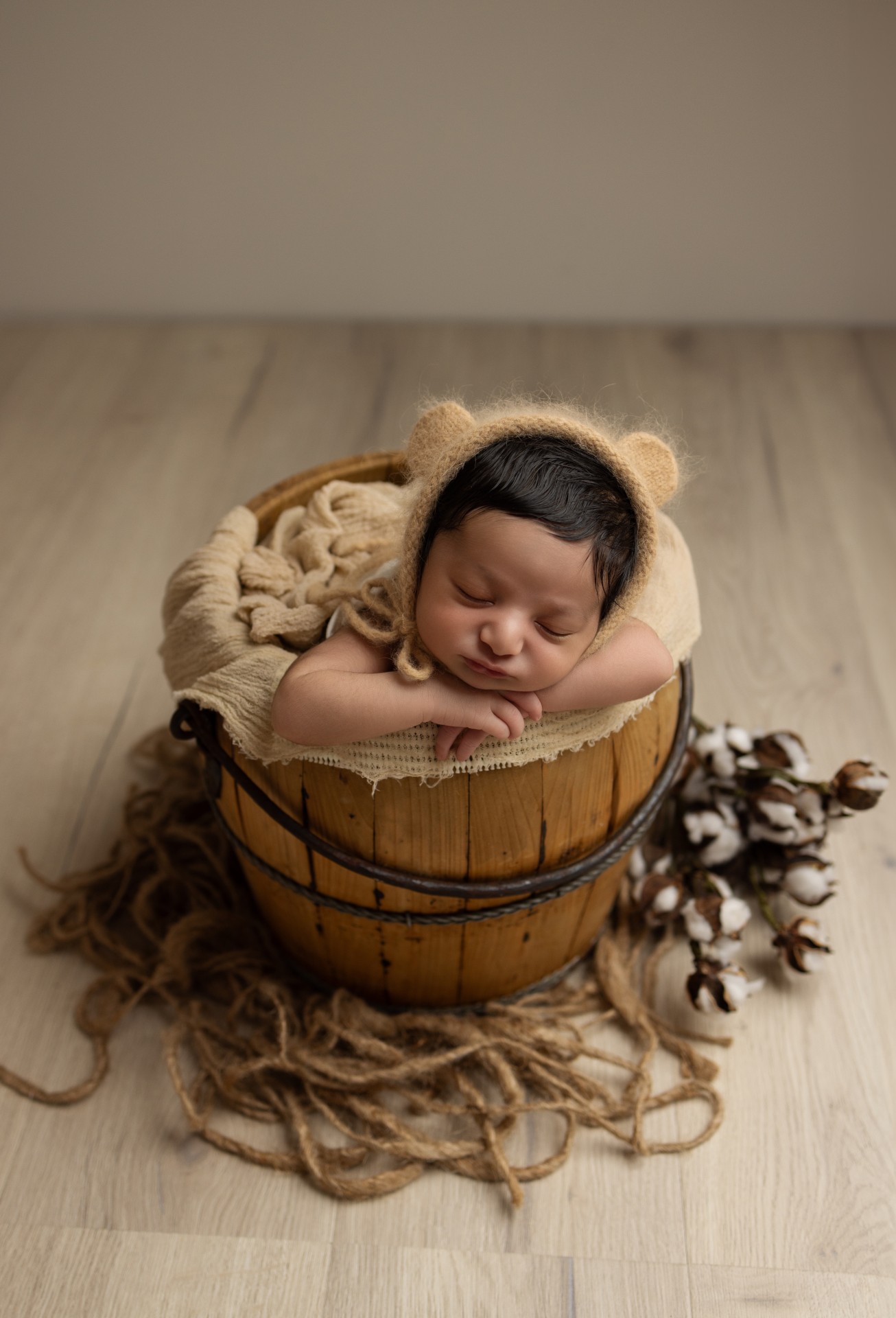newborn sleeping in bucket