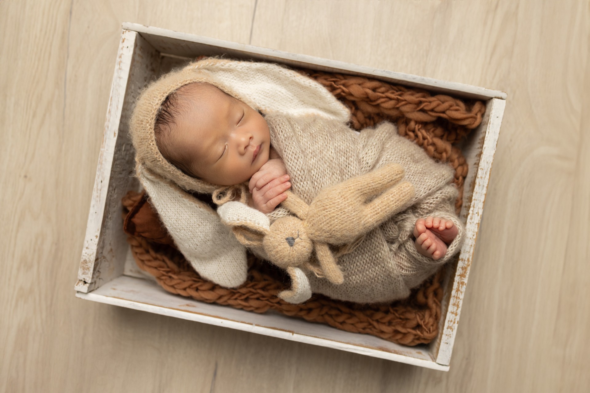 baby in basket with little bunny