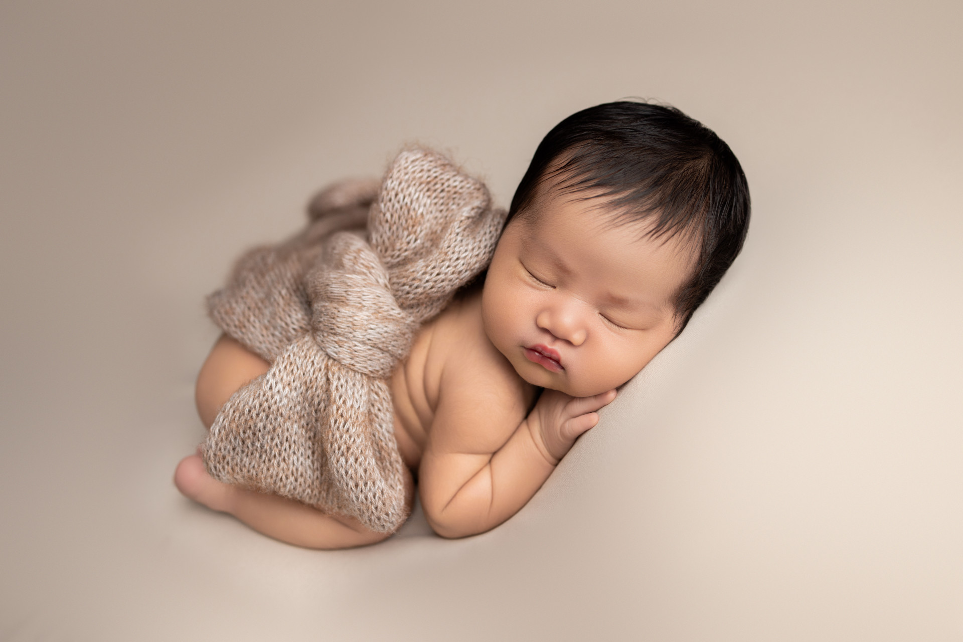 baby wraped in a bow