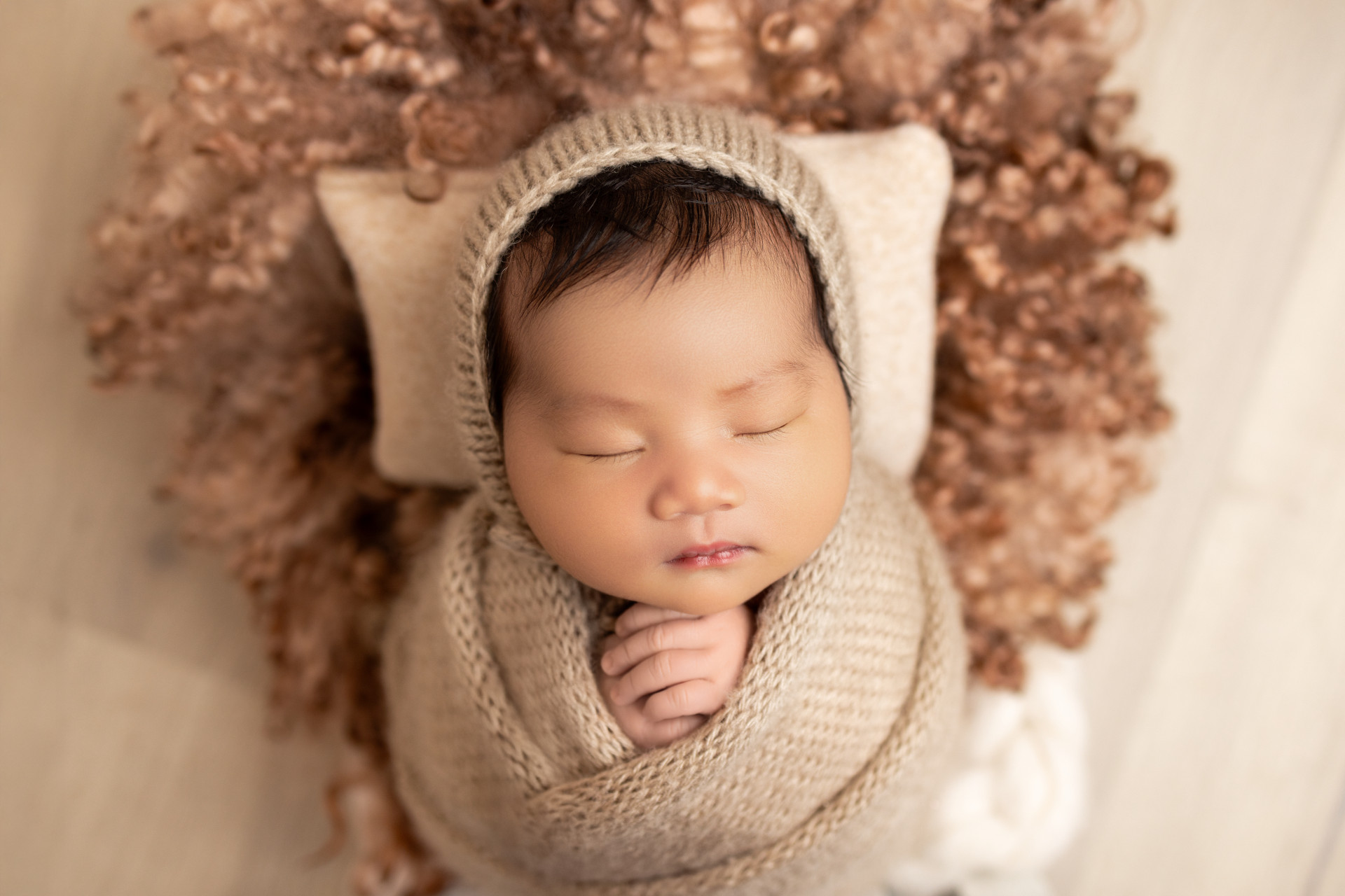 baby wraped and wearing the beannie