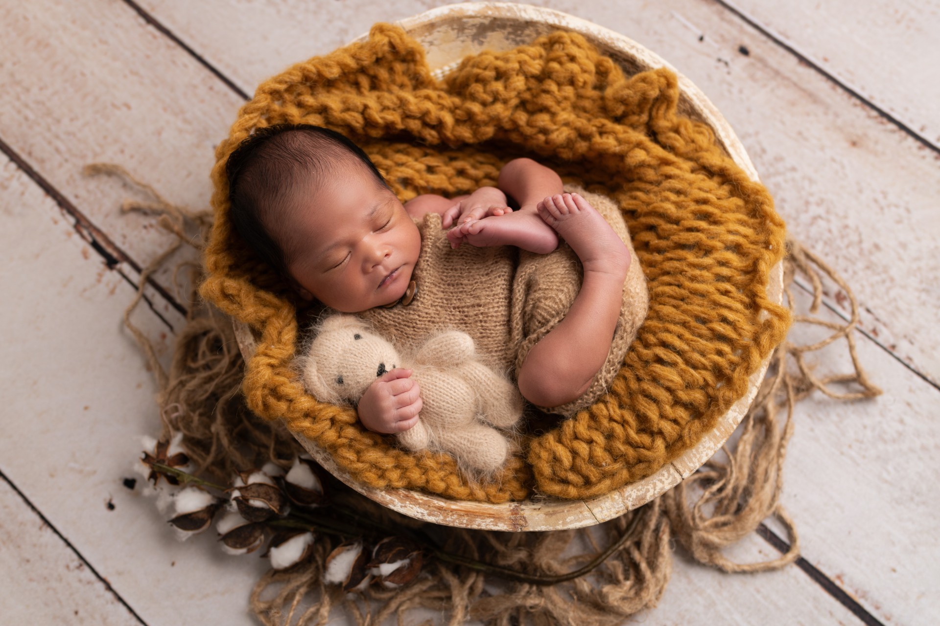 newborn baby in the vintage basket