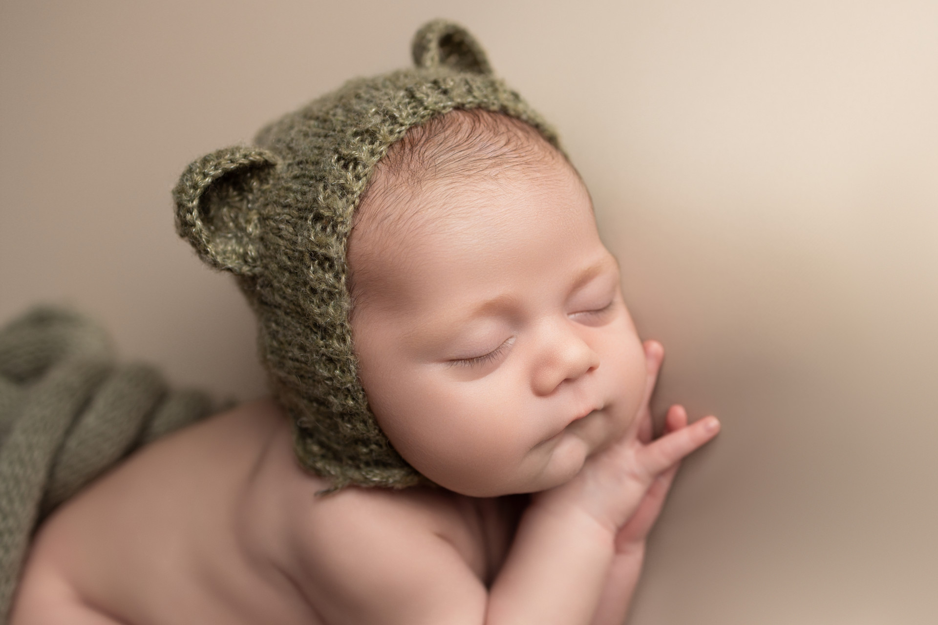 newborn with teddy bonnet