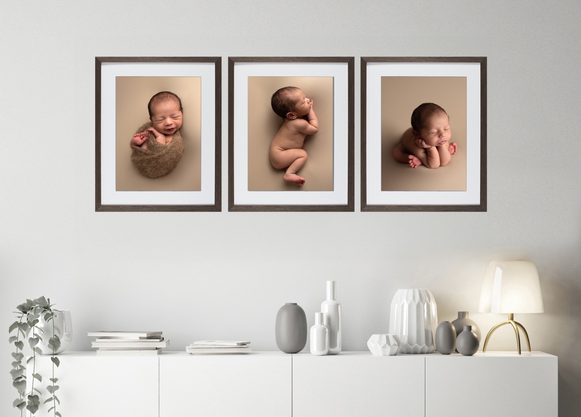 Photos of a newborn on the wall in row